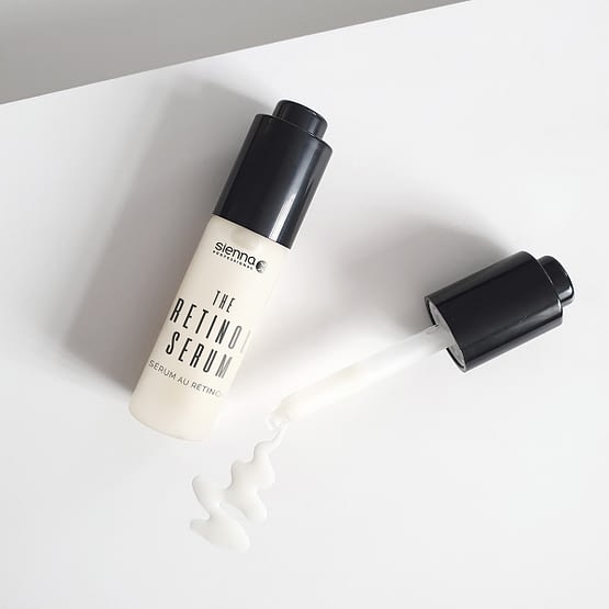 the retinol serum by sienna x. The image shows the product bottle with the pipette applicator laid next to it.